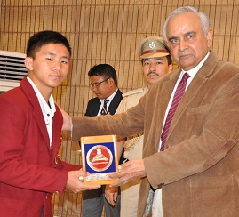 The Governor of Arunachal Pradesh Lt. General Nirbhay Sharma felicitating National Bravery Awardee Master Rumoh Meto at Raj Bhawan, Itanagar on 8th May 2015